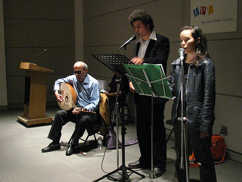John Asfour plays his oud (arabic lute), while Neworld Theatre's Marcus Youssef and Adrienne Wong read his poems, photo by Todd Wong